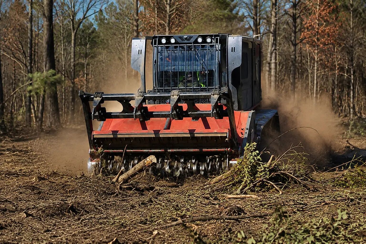 Forestry mulcher clearing brush and small trees